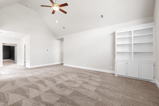 empty room with light carpet, high vaulted ceiling, and ceiling fan