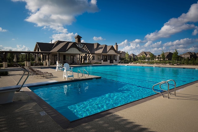 view of pool featuring a patio