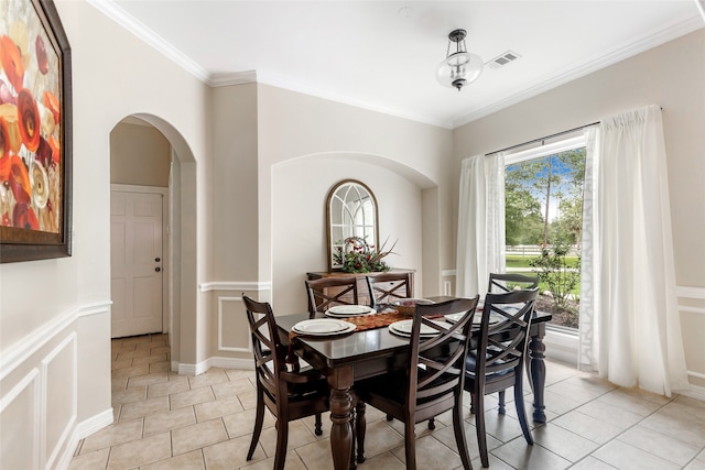 tiled dining space with crown molding