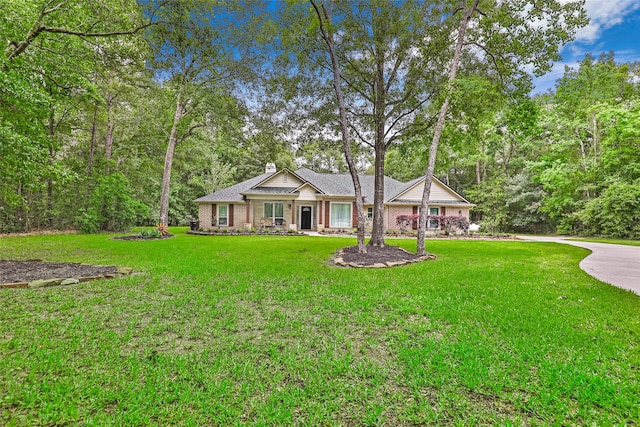 ranch-style home with a front yard