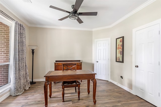 office featuring hardwood / wood-style floors, ceiling fan, and crown molding