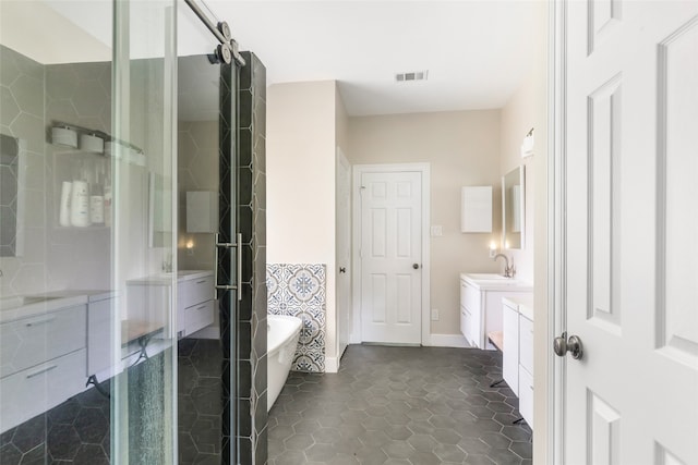 bathroom with separate shower and tub, tile patterned flooring, and vanity