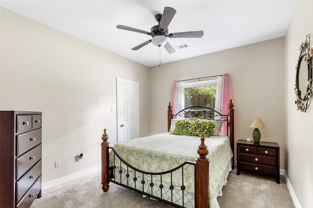 carpeted bedroom with ceiling fan