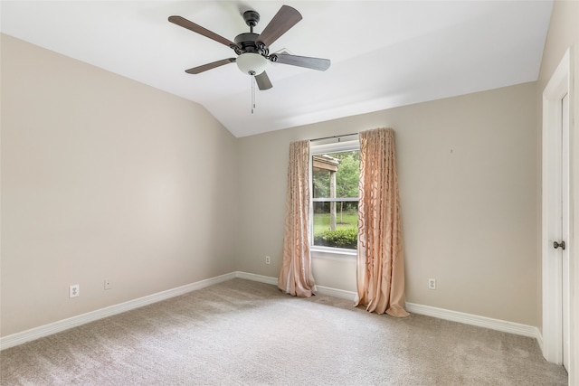 spare room with light carpet, ceiling fan, and lofted ceiling