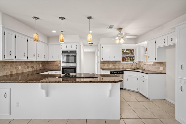 1133 Sally Anne Dr, Rosenberg, TX 77471 - kitchen with a sink, a peninsula, stainless steel appliances, and backsplash