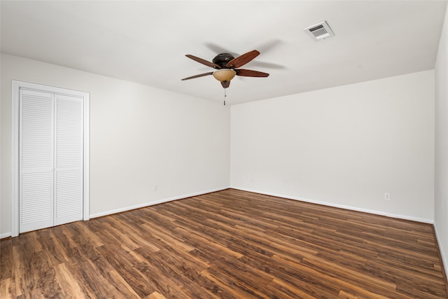 unfurnished room featuring ceiling fan and dark hardwood / wood-style flooring