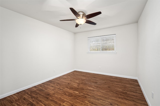 empty room featuring dark hardwood / wood-style floors and ceiling fan