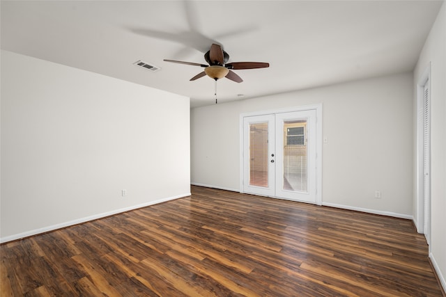 spare room with ceiling fan, dark wood-type flooring, and french doors