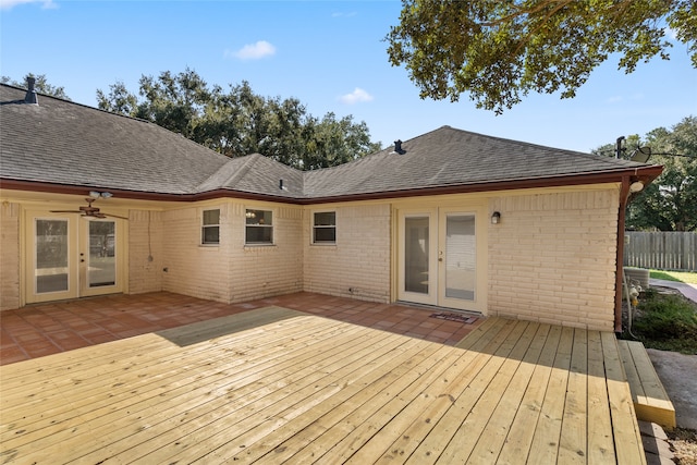 wooden deck featuring french doors, a patio, and ceiling fan