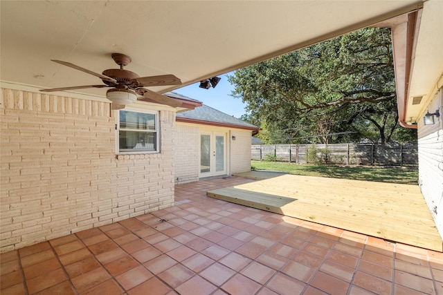 1133 Sally Anne Dr, Rosenberg, TX 77471 - fenced backyard with french doors, ceiling fan, a wooden deck, and a patio area