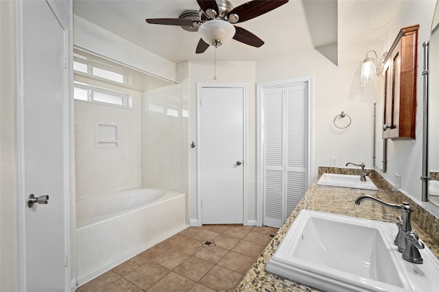 bathroom with tile patterned flooring, vanity, and ceiling fan