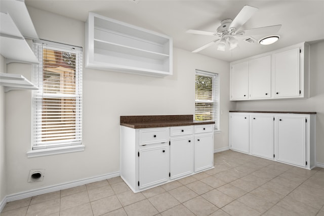 clothes washing area featuring ceiling fan and light tile patterned floors