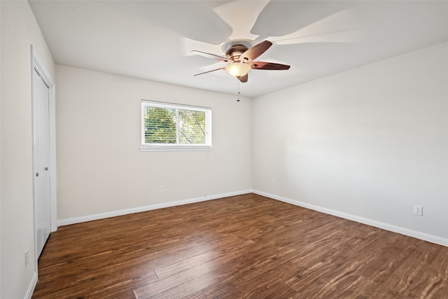 spare room with ceiling fan and dark hardwood / wood-style floors