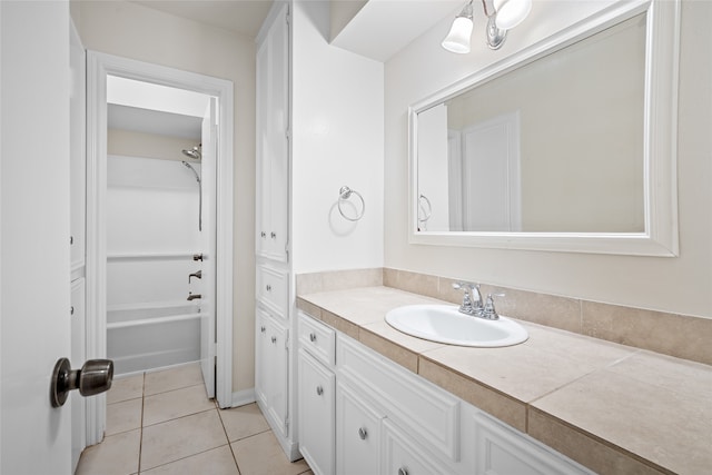 bathroom featuring bathing tub / shower combination, tile patterned floors, and vanity