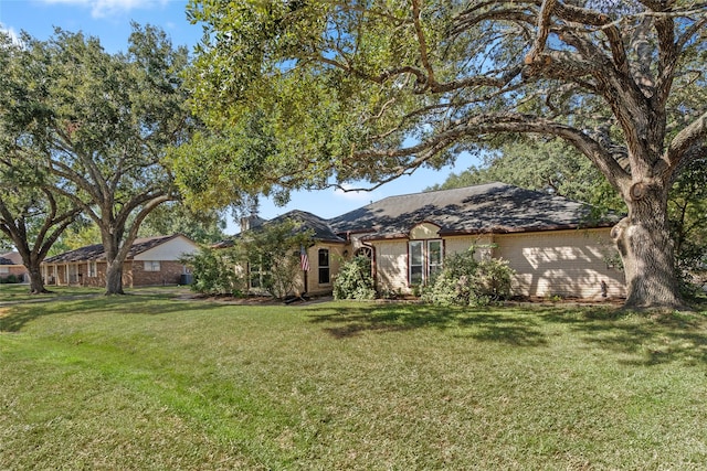 ranch-style house with a front lawn