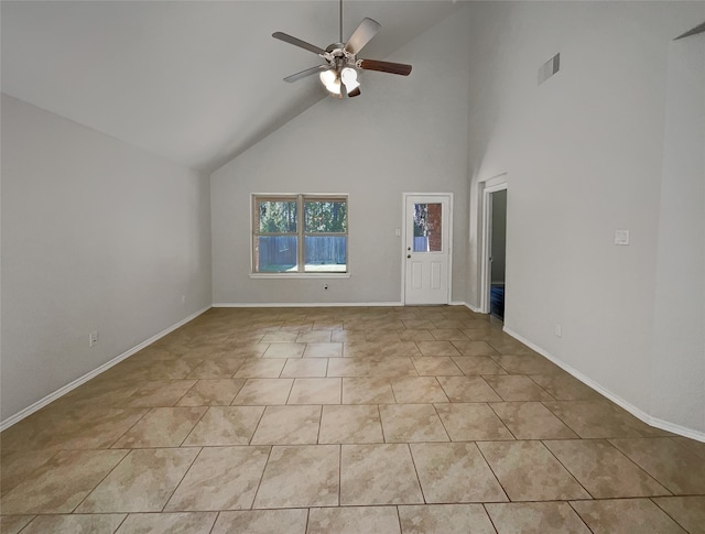 tiled spare room with high vaulted ceiling and ceiling fan