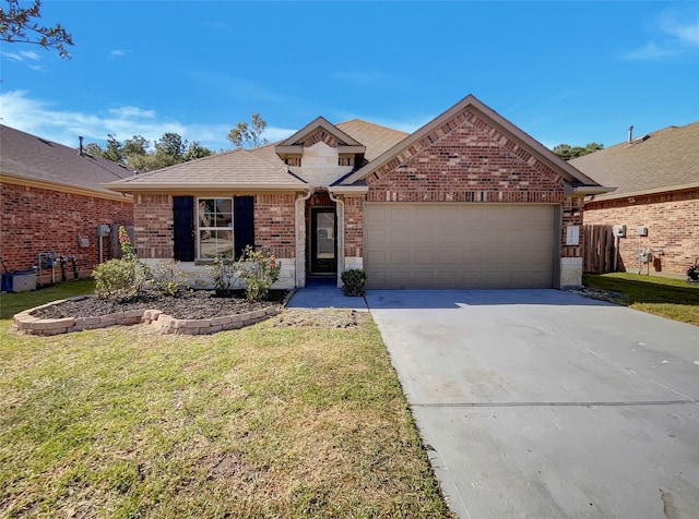 view of front of property with a garage and a front lawn