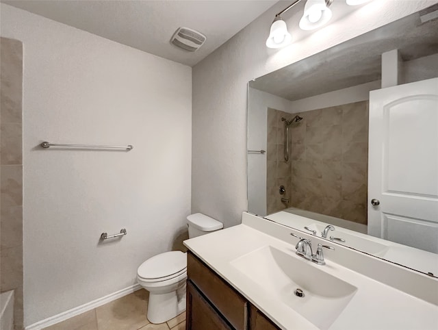 full bathroom with tiled shower / bath, vanity, tile patterned flooring, and toilet