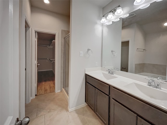 bathroom featuring vanity, separate shower and tub, and wood-type flooring