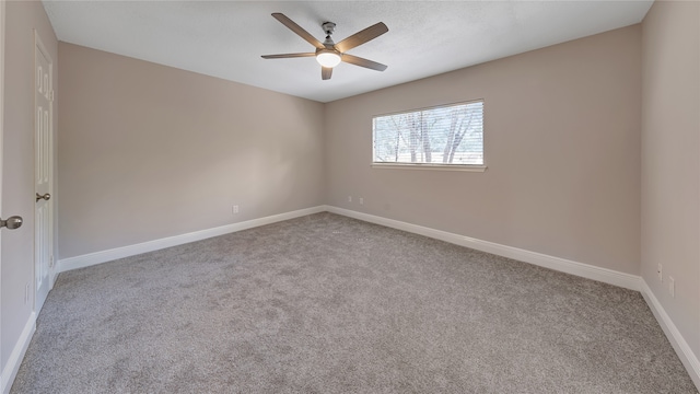 unfurnished room with ceiling fan and light colored carpet