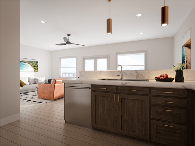 kitchen with light hardwood / wood-style flooring, dark brown cabinets, decorative light fixtures, sink, and dishwasher