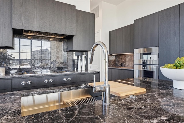 kitchen with visible vents, decorative backsplash, oven, refrigerator, and marble finish floor