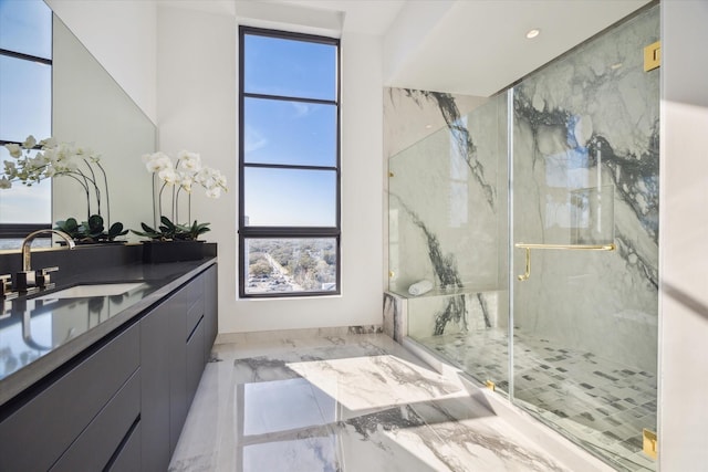 full bathroom with marble finish floor, recessed lighting, a marble finish shower, and vanity