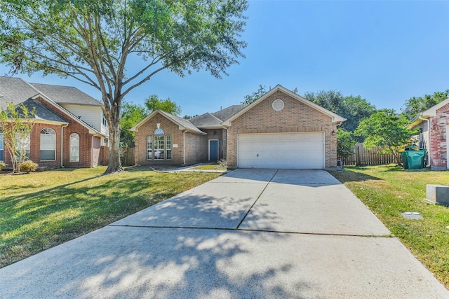 view of front facade featuring a front yard and a garage