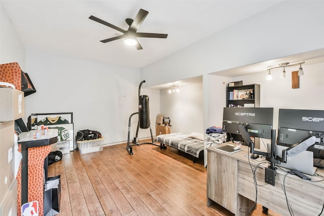 interior space with ceiling fan and hardwood / wood-style floors