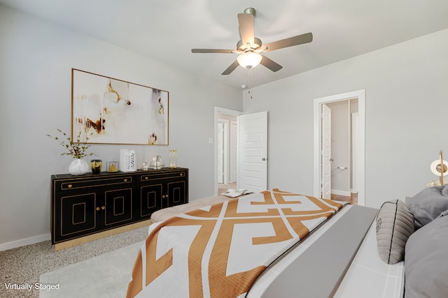 bedroom featuring ceiling fan and connected bathroom