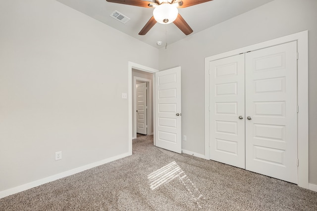 unfurnished bedroom featuring ceiling fan, carpet floors, and a closet