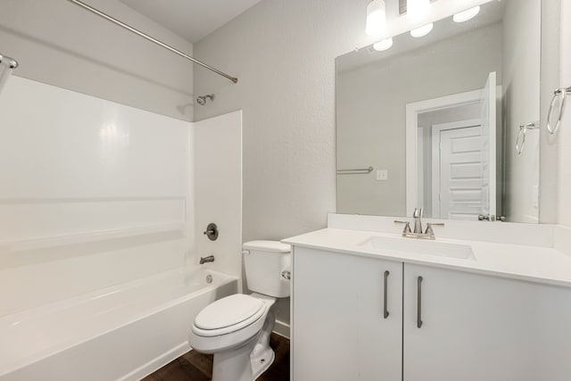 full bathroom featuring hardwood / wood-style flooring, vanity, toilet, and  shower combination