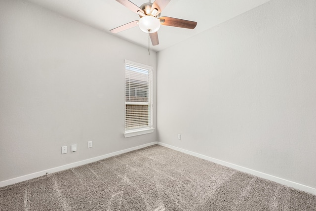 unfurnished room with ceiling fan and carpet flooring