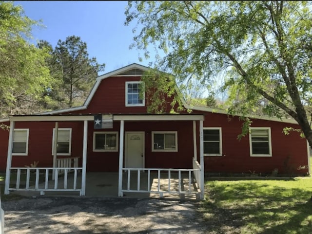 view of front facade with a front lawn and a porch