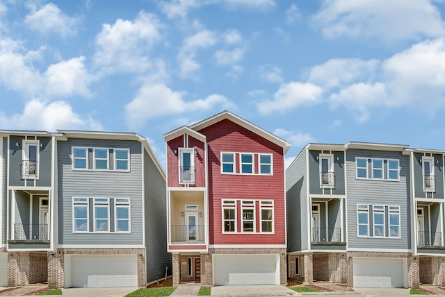 townhome / multi-family property featuring a garage and a balcony