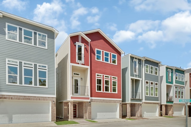 townhome / multi-family property featuring a garage