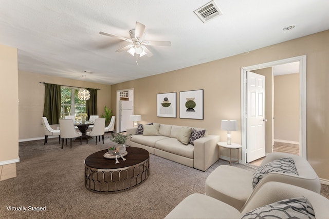 living room with carpet flooring and ceiling fan