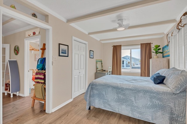 bedroom with ornamental molding, hardwood / wood-style floors, beam ceiling, and ceiling fan