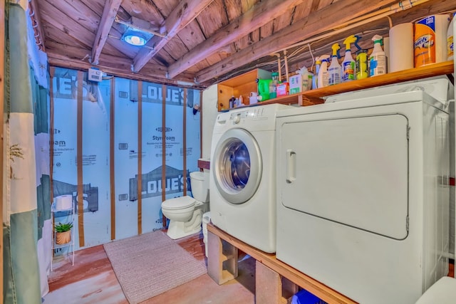 clothes washing area with separate washer and dryer