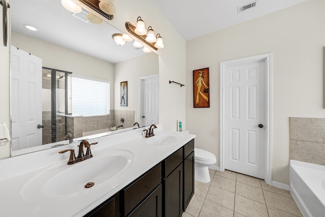 full bathroom with vanity, tile patterned flooring, toilet, and separate shower and tub