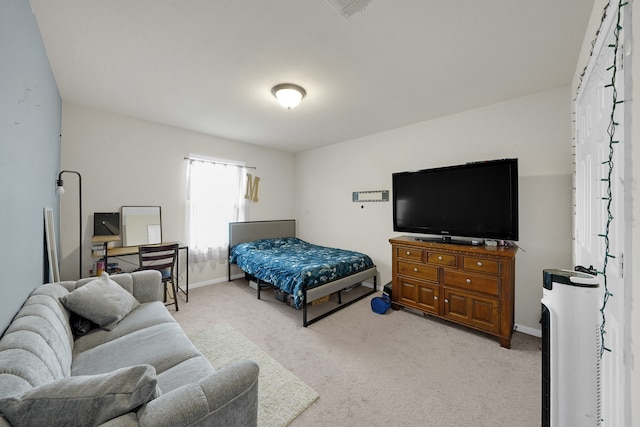 bedroom with light colored carpet