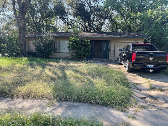 single story home with a garage