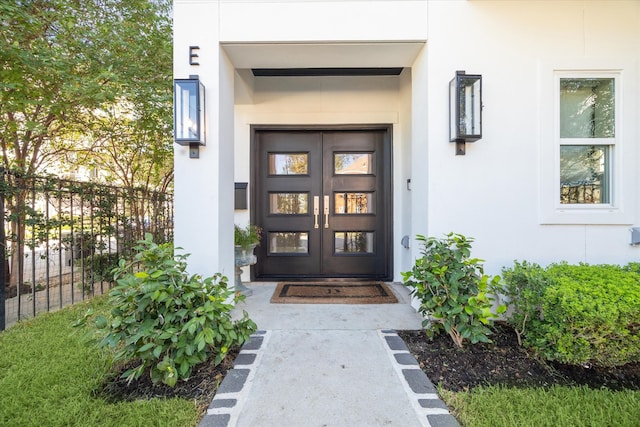 property entrance featuring french doors