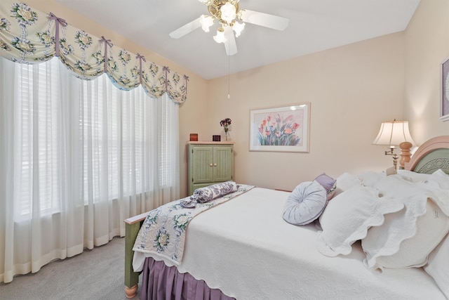 bedroom with ceiling fan and carpet flooring