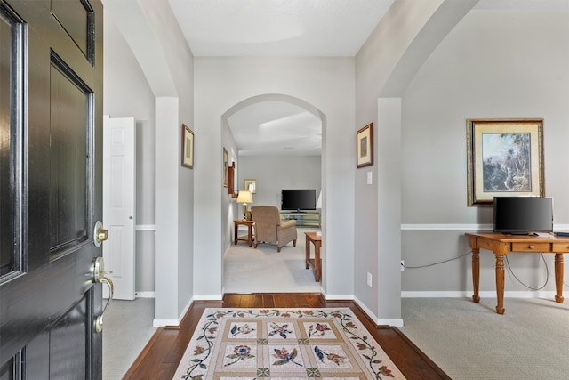 entrance foyer with dark hardwood / wood-style flooring