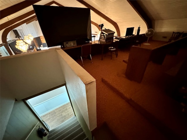 interior space with vaulted ceiling with beams