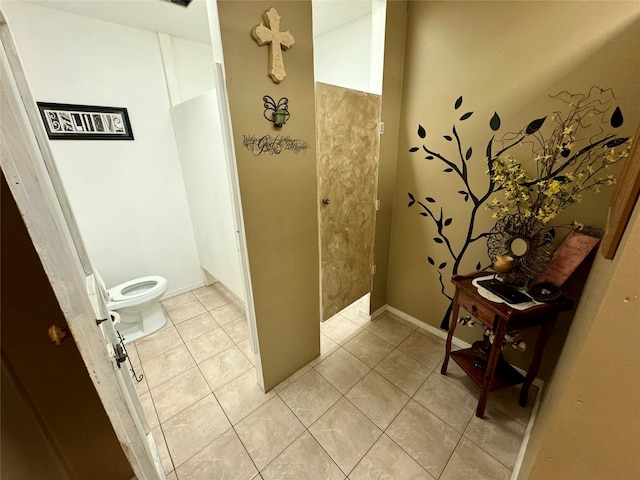 bathroom featuring tile patterned floors and toilet