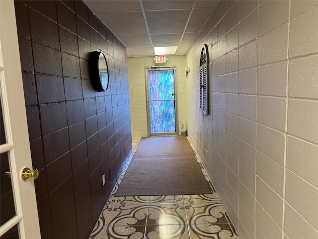 hall with light tile patterned floors