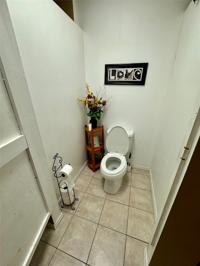 bathroom featuring tile patterned floors and toilet