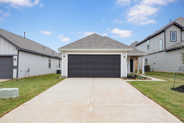 view of front facade featuring cooling unit, a front lawn, and a garage